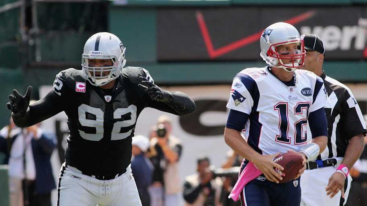  Oct 2, 2011; Oakland, CA, USA; Oakland Raiders defensive end Richard Seymour (92) reacts after being called for a personal foul against New England Patriots quarterback Tom Brady (12) in the first quarter at O.co Coliseum. Mandatory Credit: Cary Edmondson-Imagn Images | Cary Edmondson-Imagn Images 
