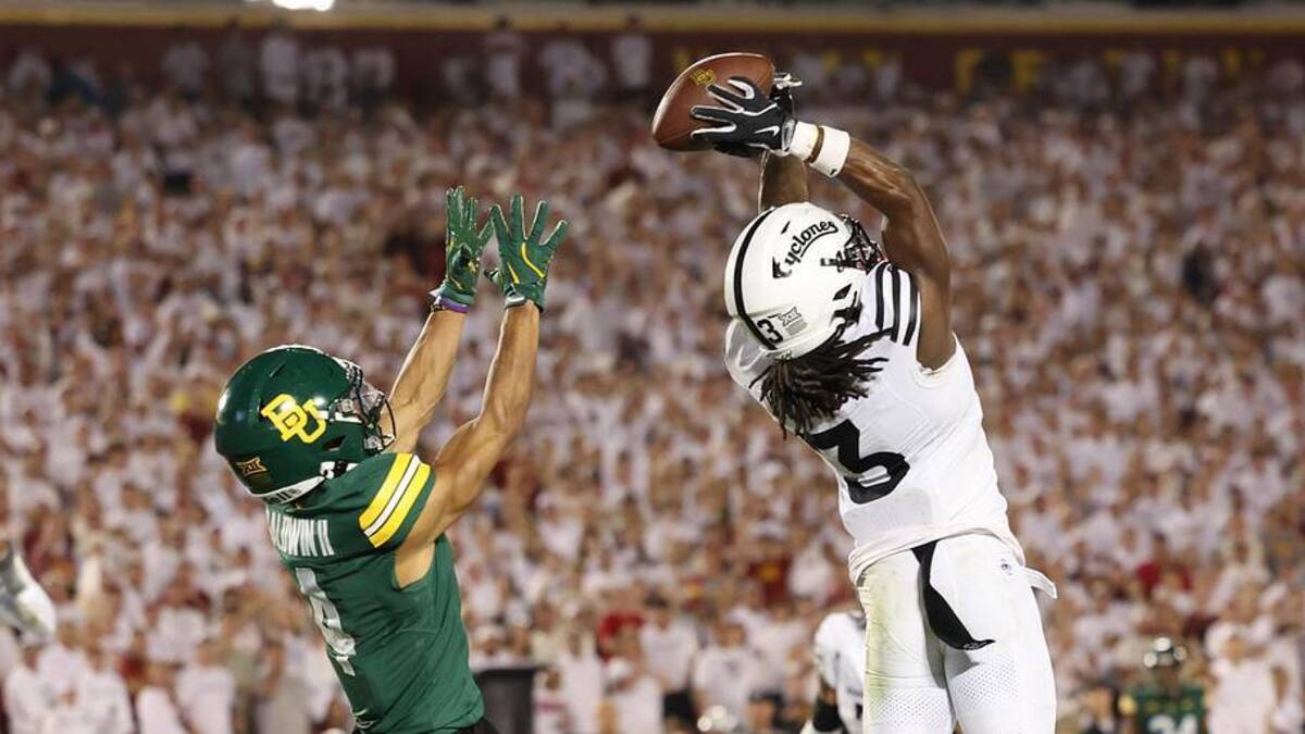  Oct 5, 2024; Ames, Iowa, USA; Iowa State Cyclones defensive back Jontez Williams (3) intercepts a pass intended for Baylor Bears wide receiver Monaray Baldwin (4) at Jack Trice Stadium. Mandatory Credit: Reese Strickland-Imagn Images | Reese Strickland-Imagn Images 
