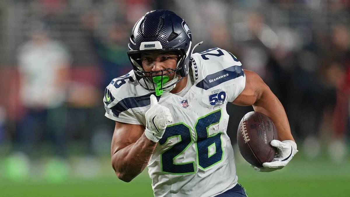  Jan 3, 2026; Santa Clara, California, USA; Seattle Seahawks running back Zach Charbonnet (26) rushes the ball against the San Francisco 49ers during the first half at Levi's Stadium. | Neville E. Guard-Imagn Images 