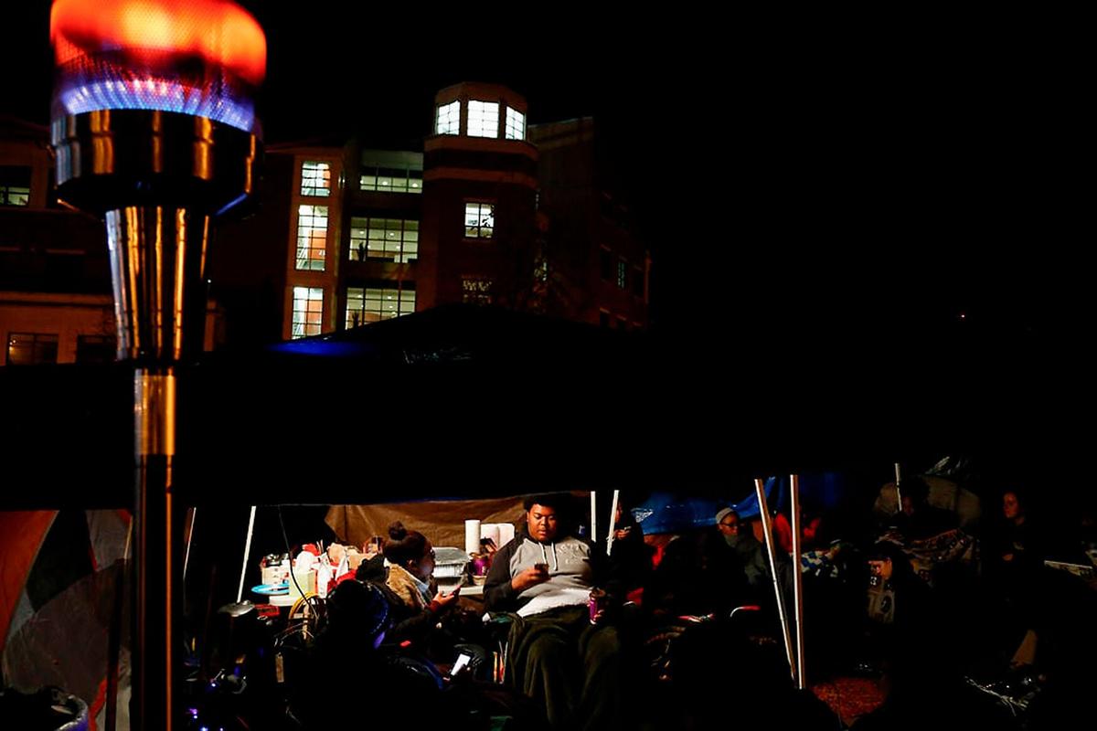 Members of Concerned Student 1950 sit in their tents on Nov. 7, 2015, on the Mel Carnahan Quadrangle. The group released a list of demands Oct. 20, 2015, that included then-University of Missouri System President Tim Wolfe's removal, as a part of a protest over the way the university handled racial harassment.