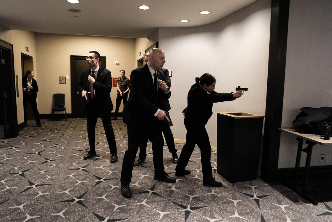 Secret Service members responding after the sound of gunfire at the Washington Hilton in Washington, on April 25, 2026. A sense of danger spread like a wave among high-profile politicians and journalists as an emergency unfolded at the White House Correspondents' Association dinner. (Salwan Georges/The New York Times)
