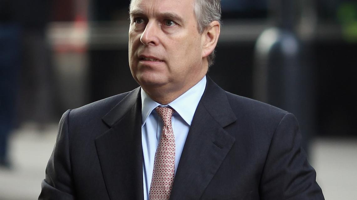 Prince Andrew Viral Photo Hung in Louvre by Activists Following His Arrest 
