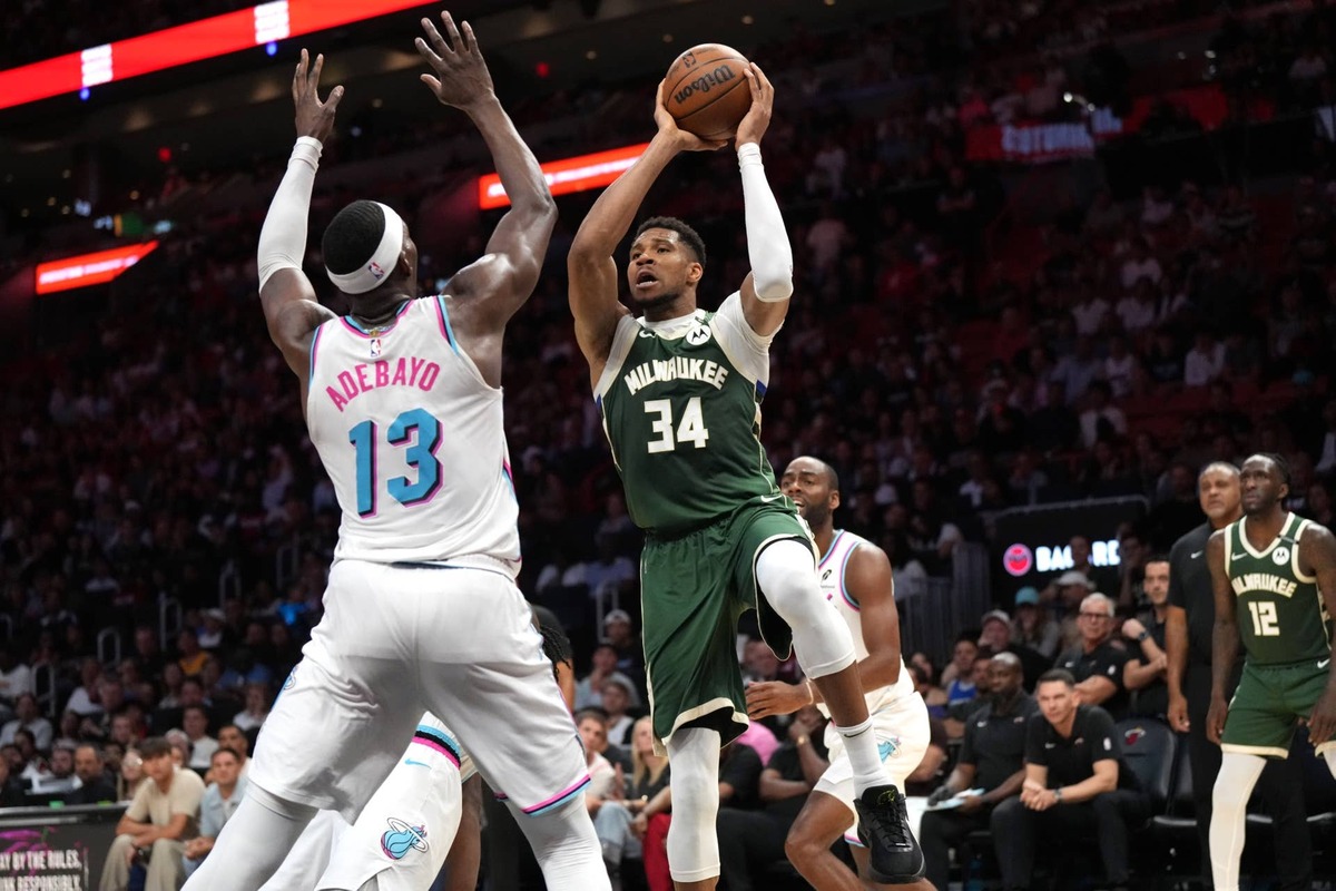  Milwaukee Bucks forward Giannis Antetokounmpo (34) looks to pass the ball as Miami Heat center Bam Adebayo (13) defends. Jim Rassol-Imagn Images