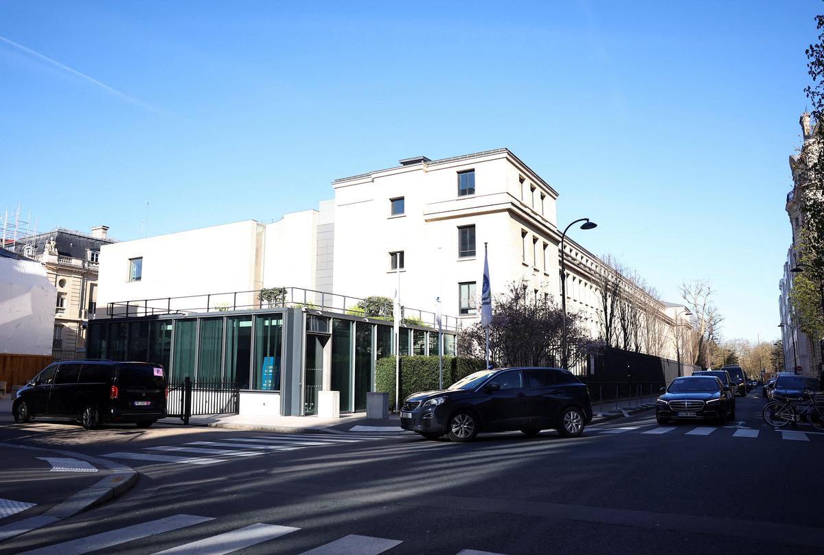 FILE PHOTO: A Chinese delegation arrives at the Organisation for Economic Co-operation and Development (OECD) headquarters for trade talks with a U.S. delegation, in Paris, France, March 15, 2026. REUTERS/Abdul Saboor/File Photo