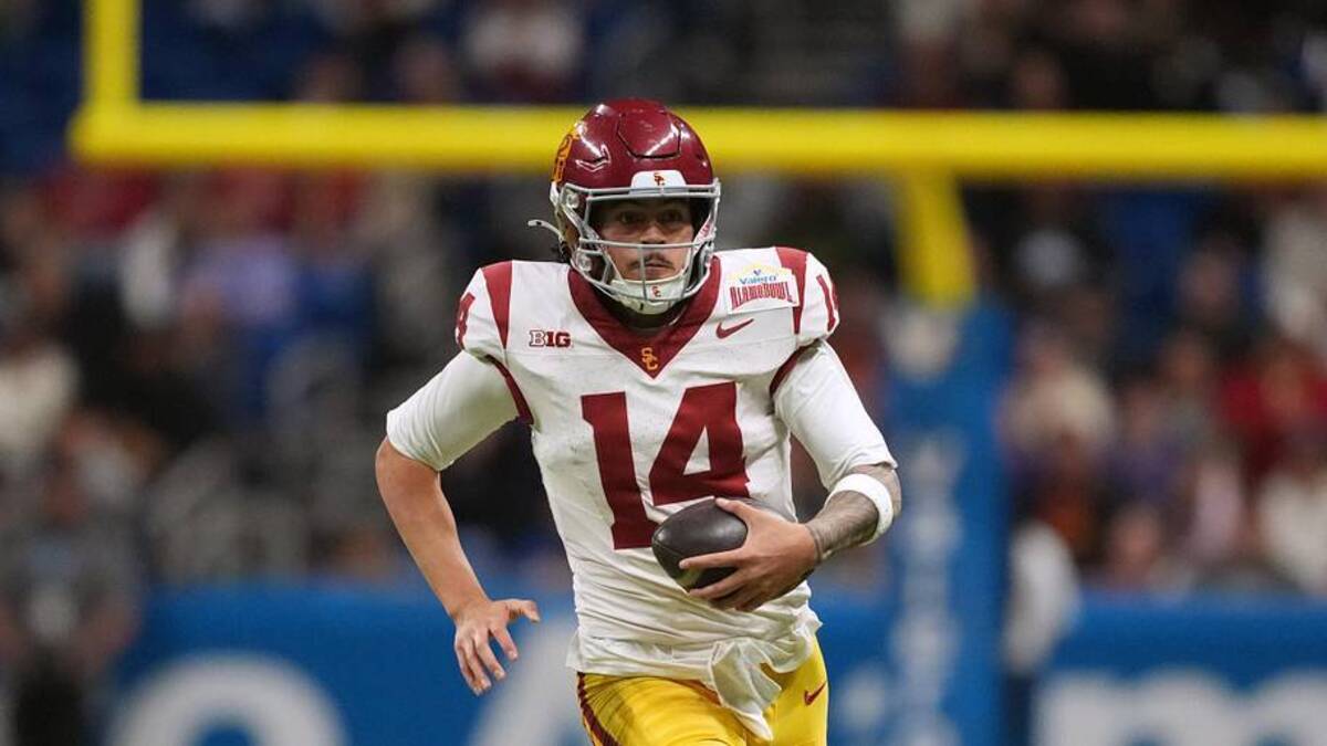 Dec 30, 2025; San Antonio, TX, USA; Southern California Trojans quarterback Jayden Maiava (14) carries the ball against the TCU Horned Frogs in the second half during the Alamo Bowl at Alamodome. Mandatory Credit: Kirby Lee-Imagn Images | Kirby Lee-Imagn Images 
