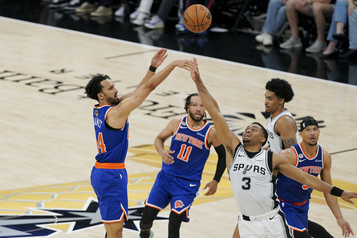 Jun 13, 2026; San Antonio, Texas, USA; New York Knicks guard Landry Shamet (44) makes a jump shot over San Antonio Spurs forward Keldon Johnson (3) during the third quarter during game five of the 2026 NBA Finals at Frost Bank Center. Mandatory Credit: Dustin Safranek-Imagn Images