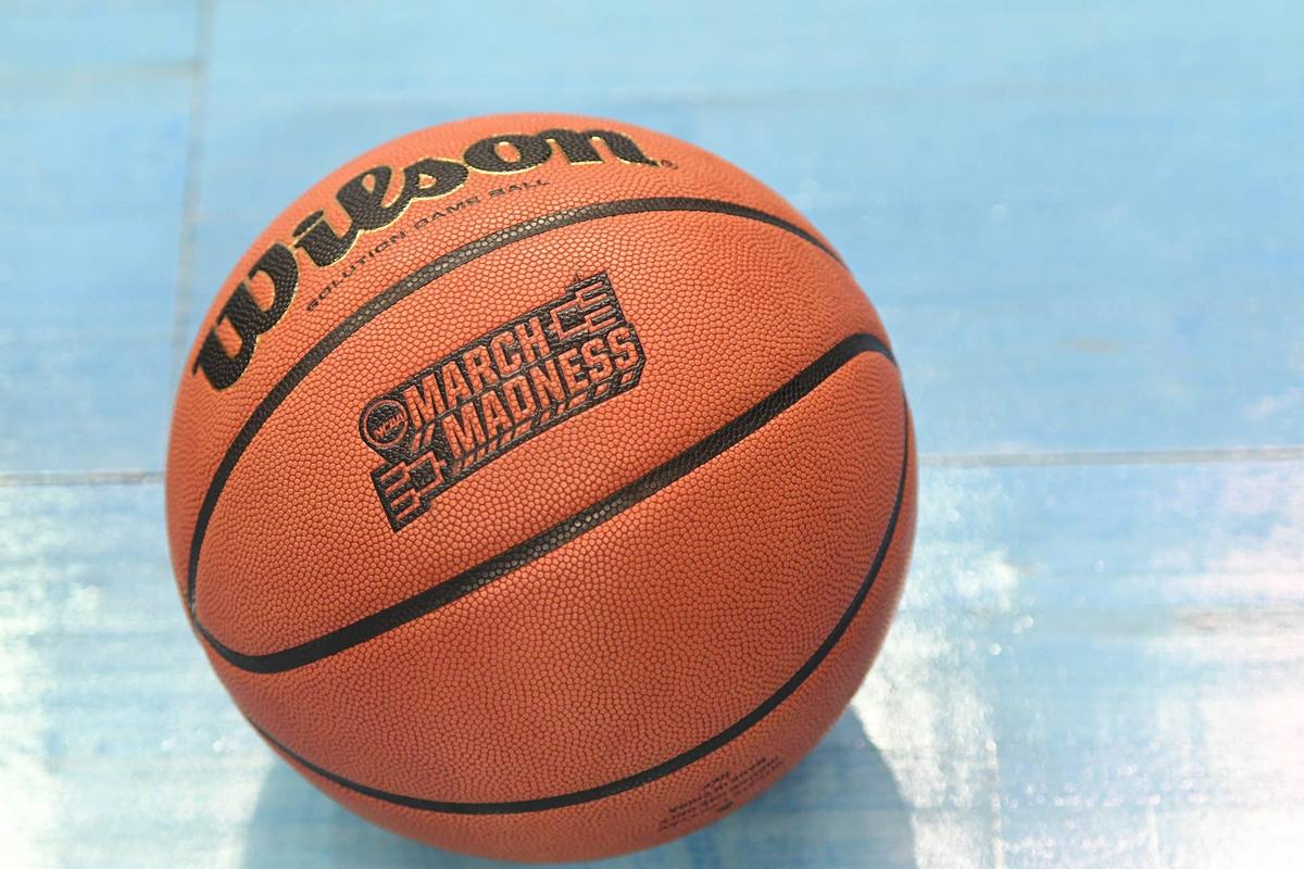  An NCAA basketball on the floor. (Photo by Mitchell Layton/Getty Images) 