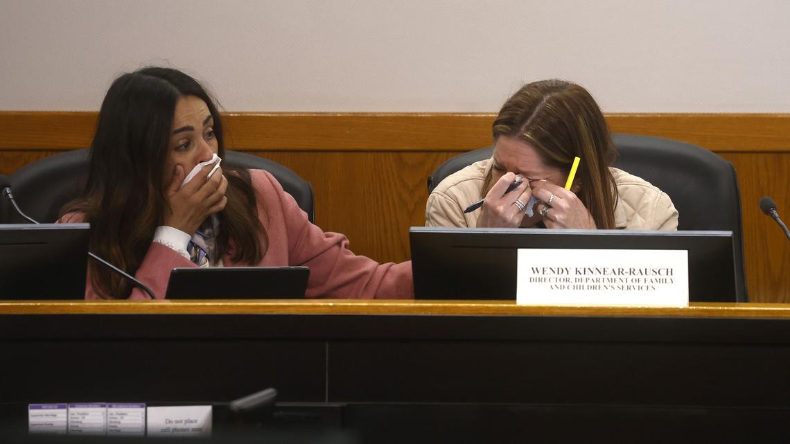Vanessa Merlano, left, director of the Department of Aging and Adult Services, comforts Wendy Kinnear-Rausch, right, director of the Department of Family and Children Services, as they listen to Santa Clara County Supervisor Sylvia Arenas speaks during a Children and Families committee meeting at the Santa Clara County Building in San Jose, California, on Thursday, April 23, 2026. (Nhat V. Meyer/Bay Area News Group/TNS)