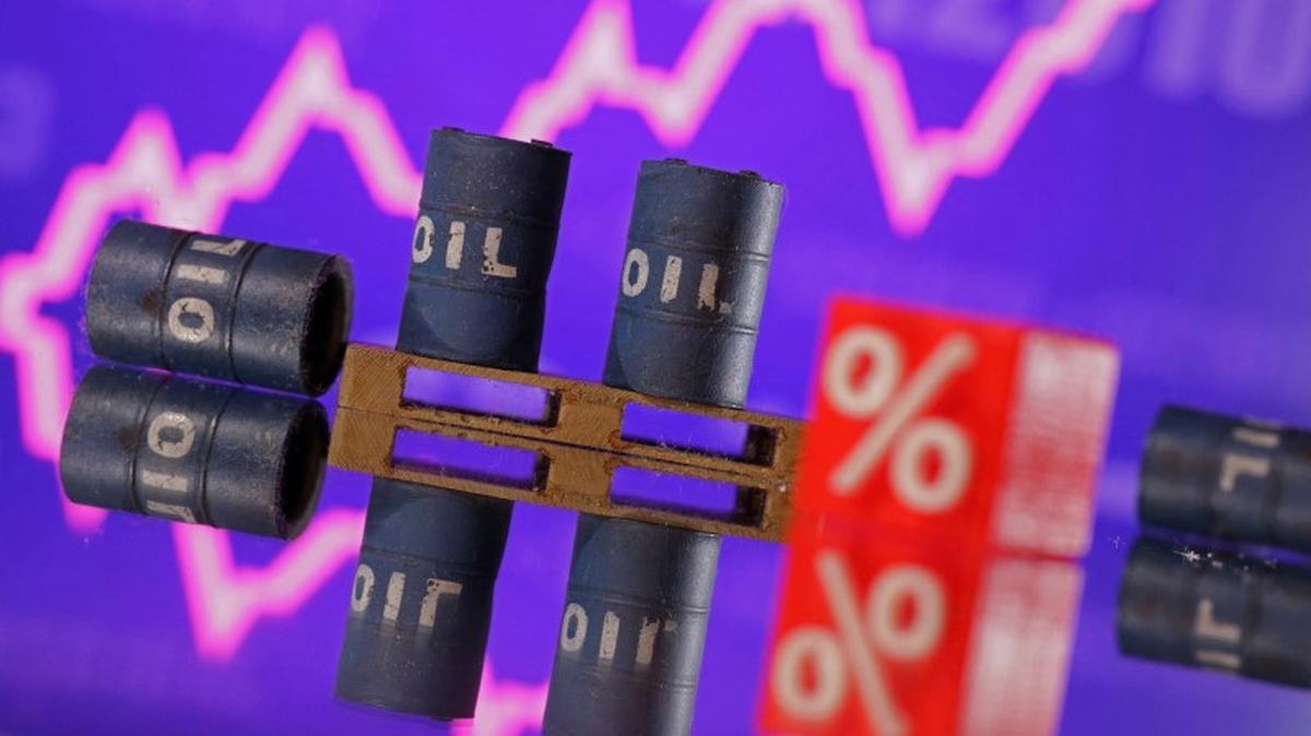 Miniatures of oil barrels and a rising stock graph are seen in this illustration taken January 15, 2024. REUTERS/Dado Ruvic/Illustration