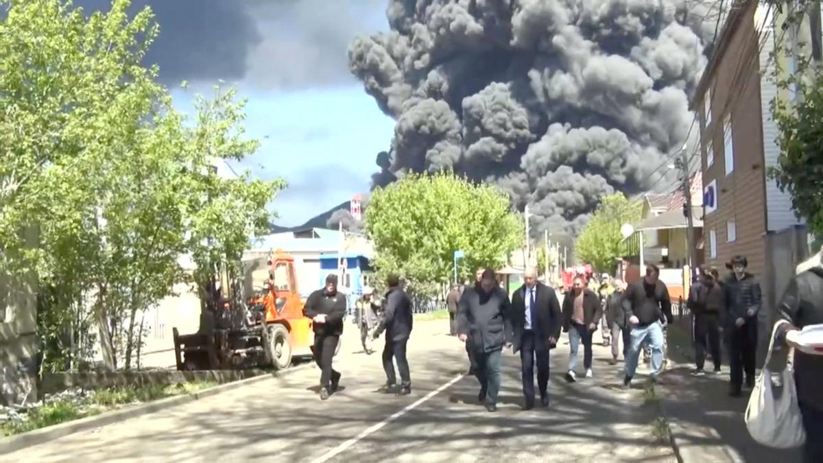 Officials walk along a street during a visit by Krasnodar region's Governor Veniamin Kondratyev, who inspects emergency services following a Ukrainian drone attack that caused a fire at an oil refinery, amid the Russia-Ukraine conflict, in Tuapse, Russia, April 28, 2026, in this still image taken from video. Governor of Krasnodar Region Veniamin Kondratyev/Handout via REUTERS