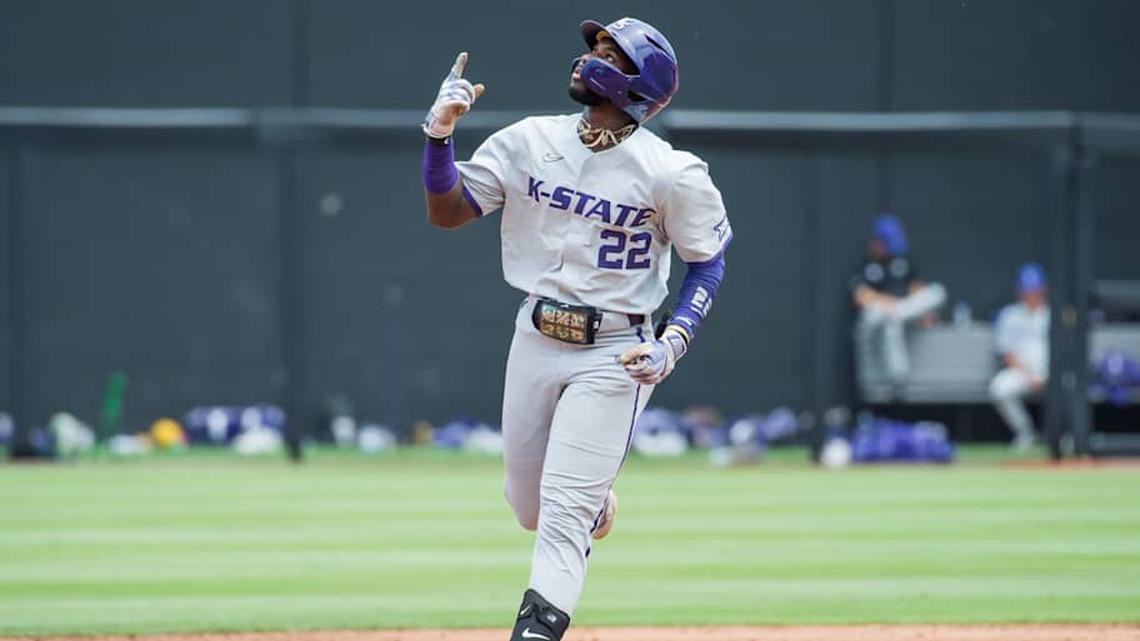  May 13, 2023; Stillwater, OK, USA; Kansas State Wildcats infielder Kaelen Culpepper (22) points up after hitting a home run during the game against the Oklahoma State Cowboys at O'Brate Stadium. | Brett Rojo-Imagn Images 