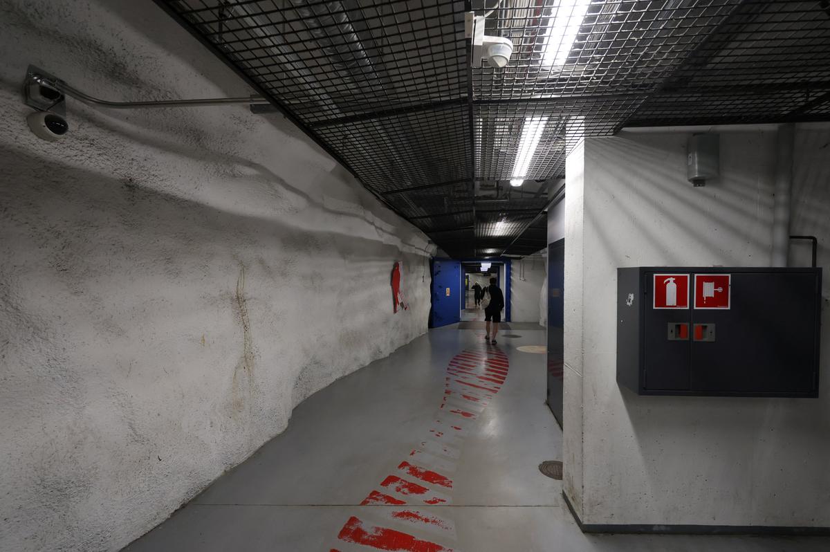 A person walks inside Merihaka civil shelter in Helsinki, Finland, May 6, 2026. REUTERS/Leonhard Foeger