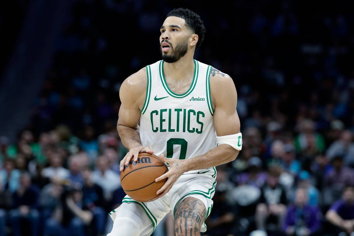  Boston Celtics forward/guard Jayson Tatum (0) prepares to attempt a jump shot against the Charlotte Hornets. Brian Westerholt-Imagn Images