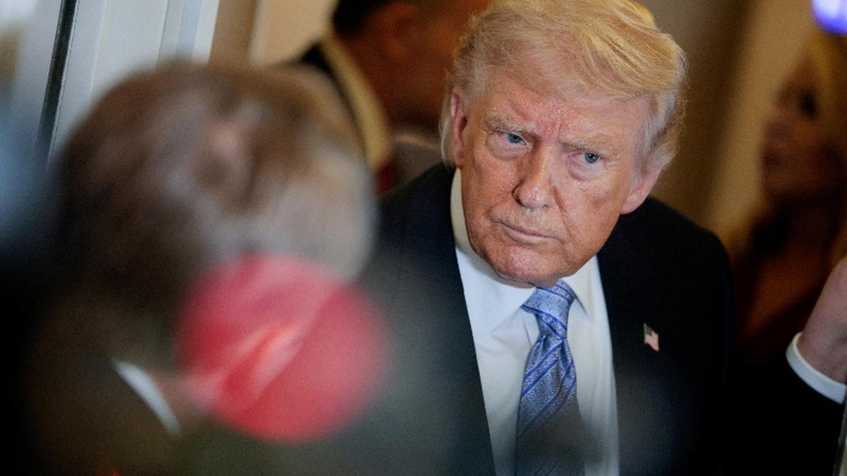 U.S. President Donald Trump speaks to the press aboard Air Force One enroute to the U.S.  following his official visit with President Xi Jinping in China, May 15, 2026. REUTERS/Evan Vucci