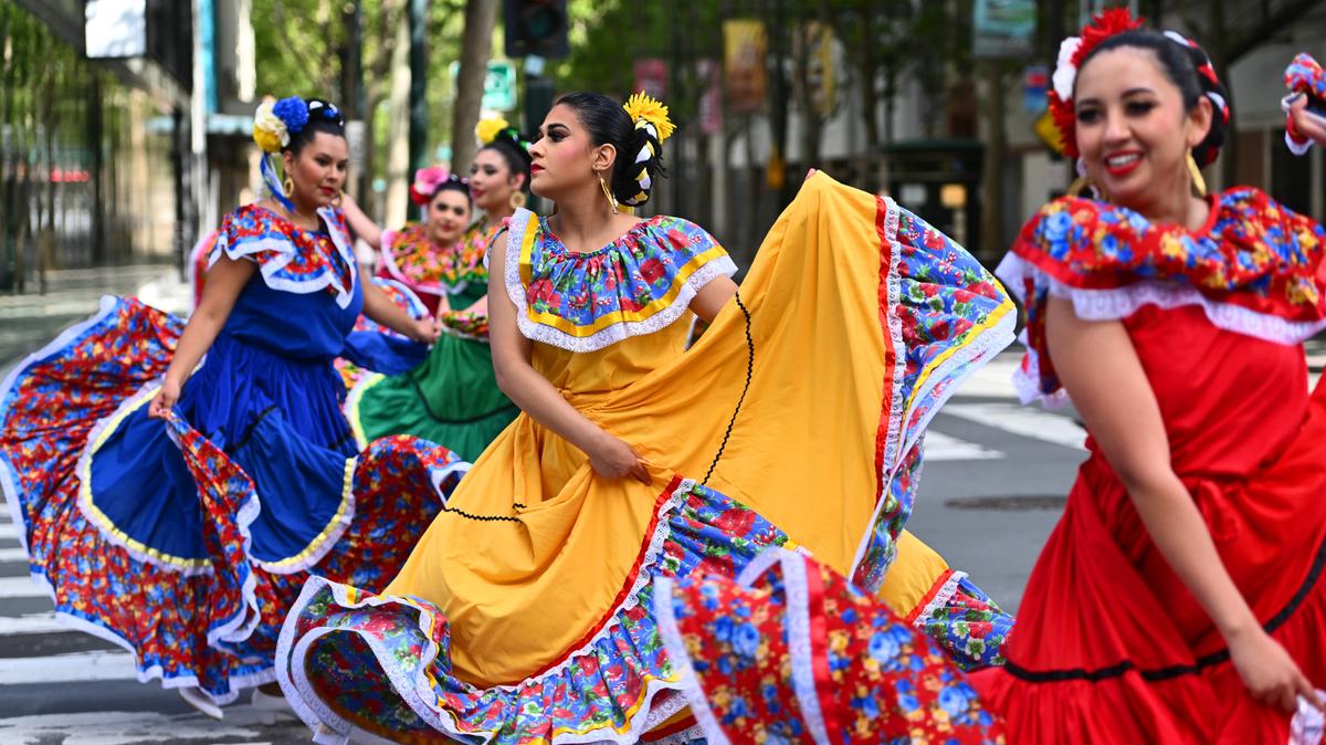 Dancers with Groupo Folklorico Luna y Sol de San Jose State perform during a Cinco de Mayo parade in San Jose, California.