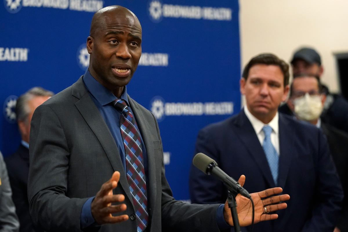 Florida Surgeon General Joseph Ladapo, left, at a news conference with Gov. Ron DeSantis on Jan. 3 at Broward Health Medical Center in Fort Lauderdale.