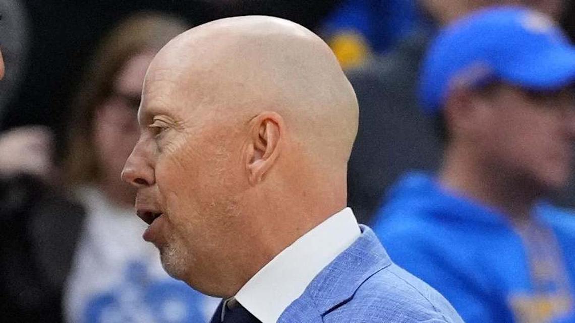  Mar 20, 2026; Philadelphia, PA, USA; UCLA Bruins head coach Mick Cronin and UCF Knights head coach Johnny Dawkins shake hands after the game during a first round game of the men's 2026 NCAA Tournament at Xfinity Mobile Arena. Mandatory Credit: Kyle Ross-Imagn Images | Kyle Ross-Imagn Images 