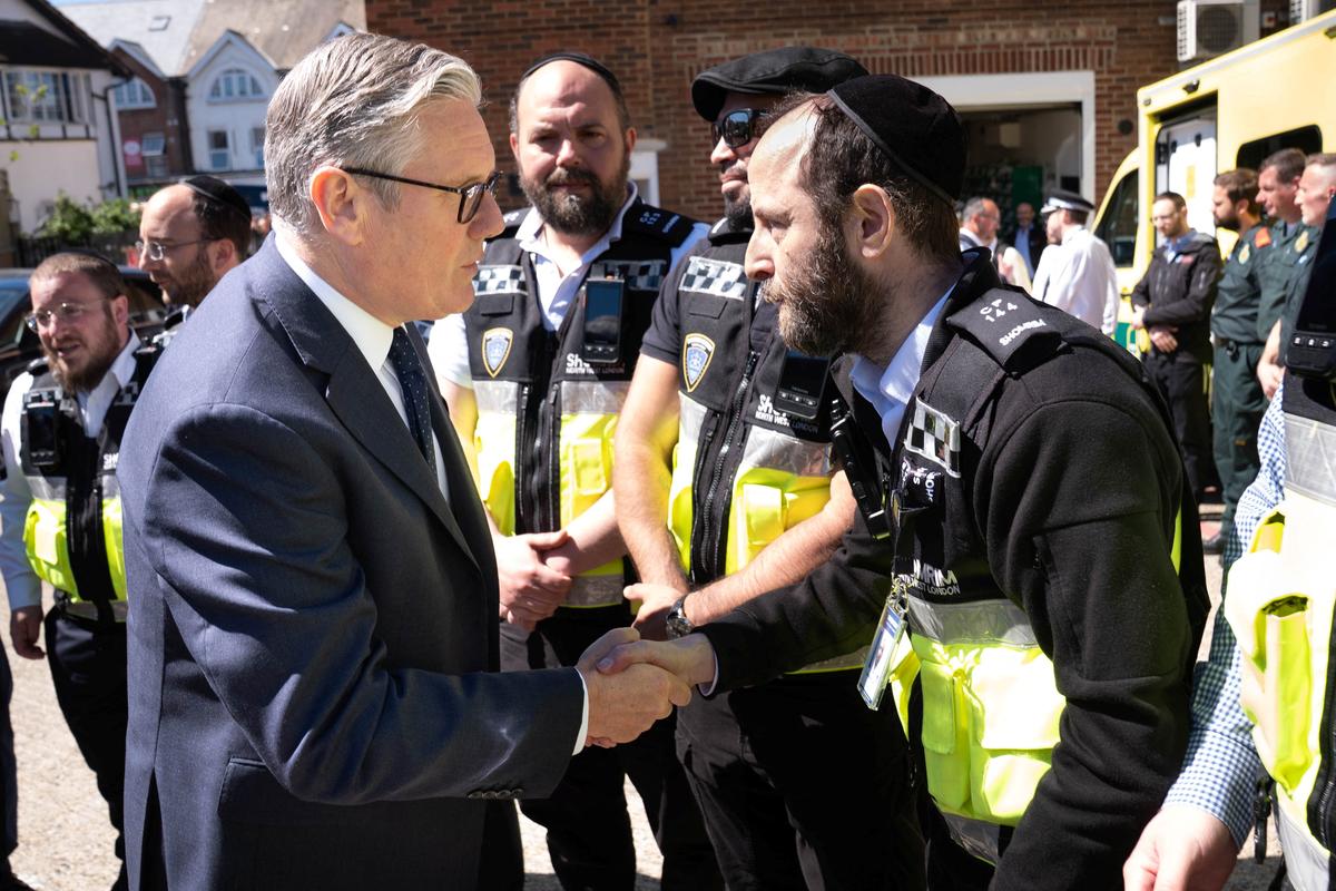 British Prime Minister Keir Starmer meets first responders from Shomrim North West London during a visit to Golders Green, north west London, following a terror attack on Wednesday morning in which two men were stabbed, in London, Britain, April 30, 2026.    Stefan Rousseau/Pool via REUTERS