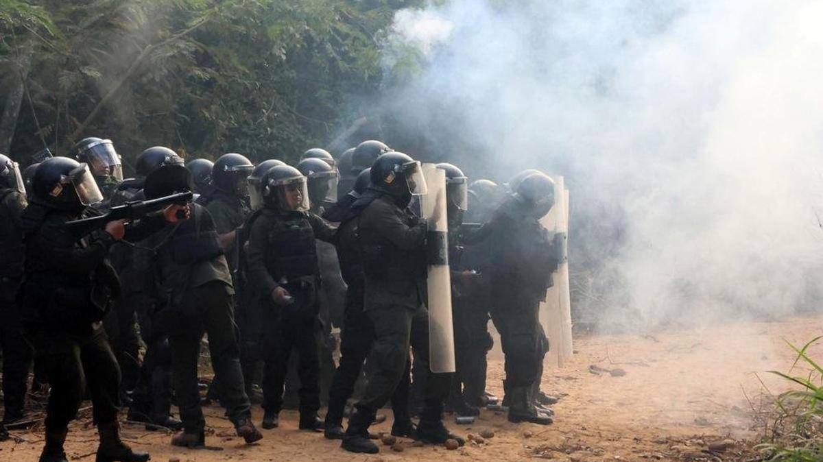 Members of the Bolivian police in riot gear deploy tear gas during an operation to regain control of the seized Humberto Suarez Roca plant and oil field, in the municipality of Santa Rosa del Sara, Bolivia, on Wednesday. Hundreds of demonstrators stormed the plant a day earlier, forcing operations to halt and blockading the facility to demand President Rodrigo Paz's resignation. Photo by Juan Carlos/EPA