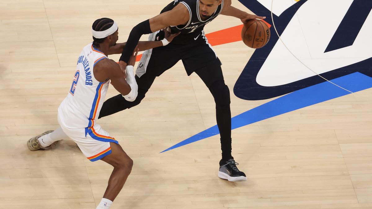 May 26, 2026; Oklahoma City, Oklahoma, USA; San Antonio Spurs forward Victor Wembanyama (1) dribbles against Oklahoma City Thunder guard Shai Gilgeous-Alexander (2) during the second quarter in game five of the western conference finals for the 2026 NBA playoffs at Paycom Center. Mandatory Credit: Brett Rojo-Imagn Images