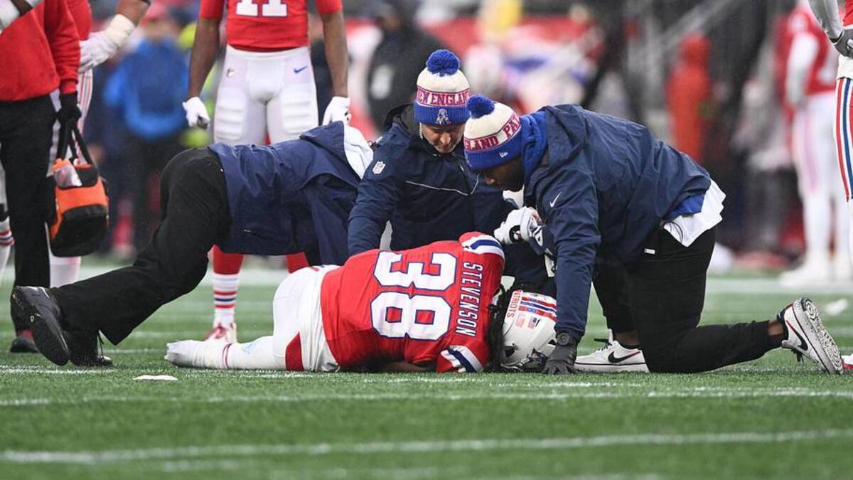  Dec 3, 2023; Foxborough, Massachusetts, USA; New England Patriots running back Rhamondre Stevenson (38) is helped by the athletic staff after an injury on a play against the Los Angeles Chargers during the first half at Gillette Stadium. Mandatory Credit: Brian Fluharty-Imagn Images | Brian Fluharty-Imagn Images 