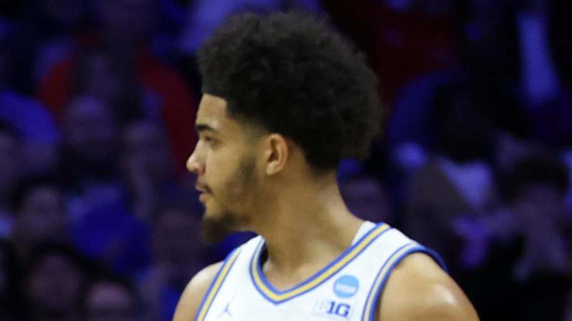  Mar 20, 2026; Philadelphia, PA, USA; UCLA Bruins guard Trent Perry (0) reacts with guard Eric Freeny (8) in the second half during a first round game of the men's 2026 NCAA Tournament at Xfinity Mobile Arena. Mandatory Credit: Bill Streicher-Imagn Images | Bill Streicher-Imagn Images 