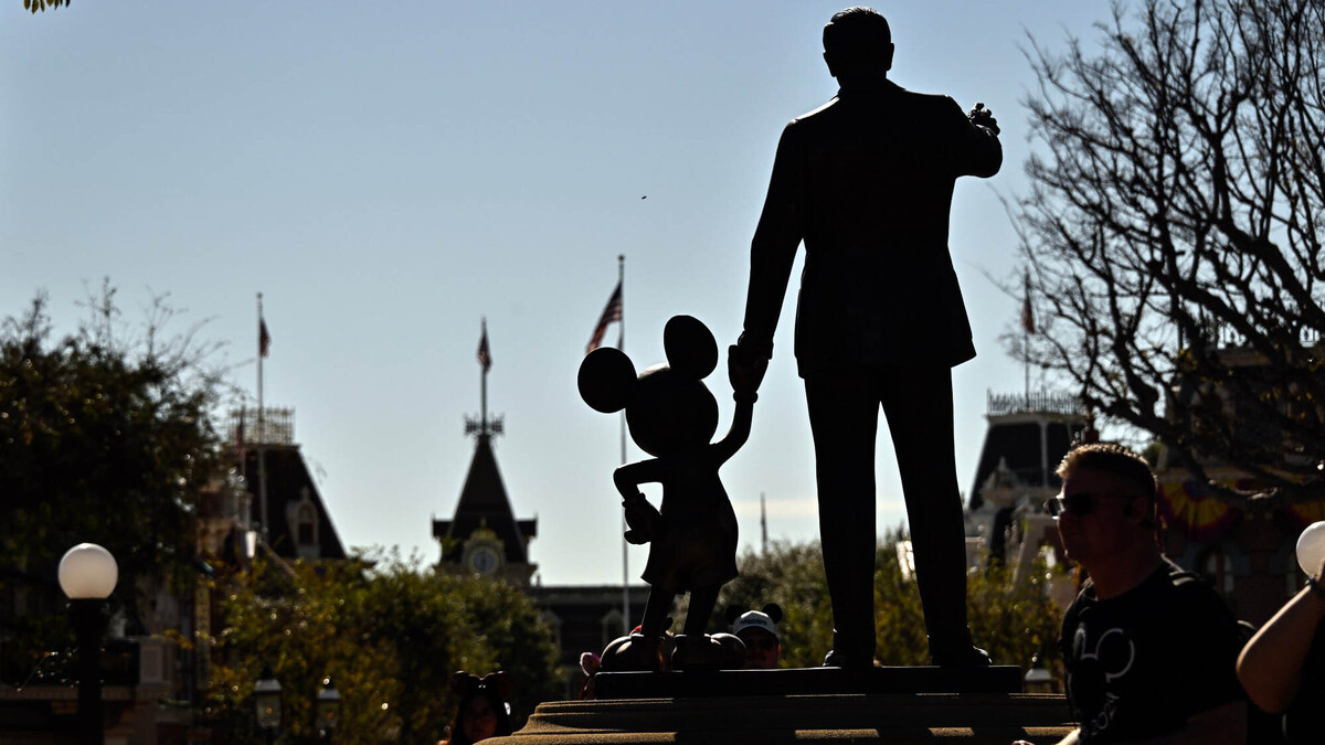 A 1993 copper statue by Blaine Gibson, "Partners," depicts Walt Disney holding the hand of Mickey Mouse, outside Sleeping Beauty Castle at the Disneyland Resort on Jan. 16, 2026, in Anaheim, California. (Jeff Gritchen/Orange County Register/TNS)