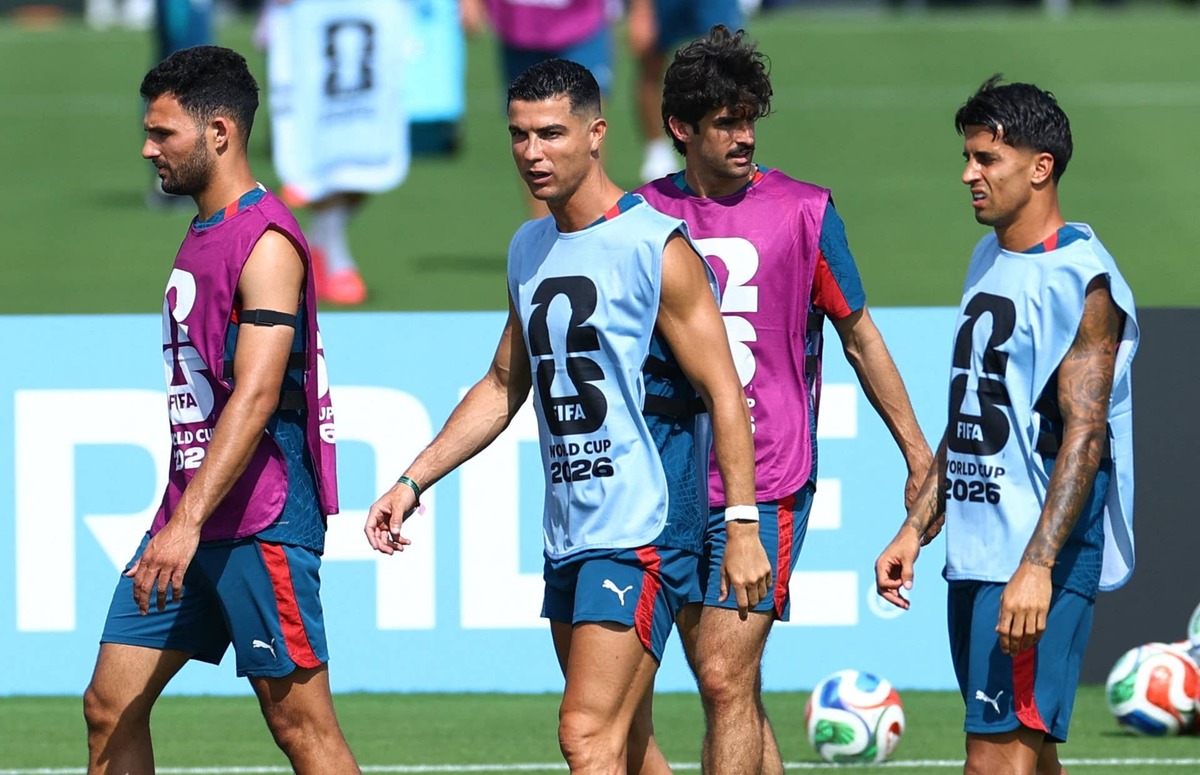  Portugal's Cristiano Ronaldo and Joao Cancelo during training. REUTERS/Marco Bello