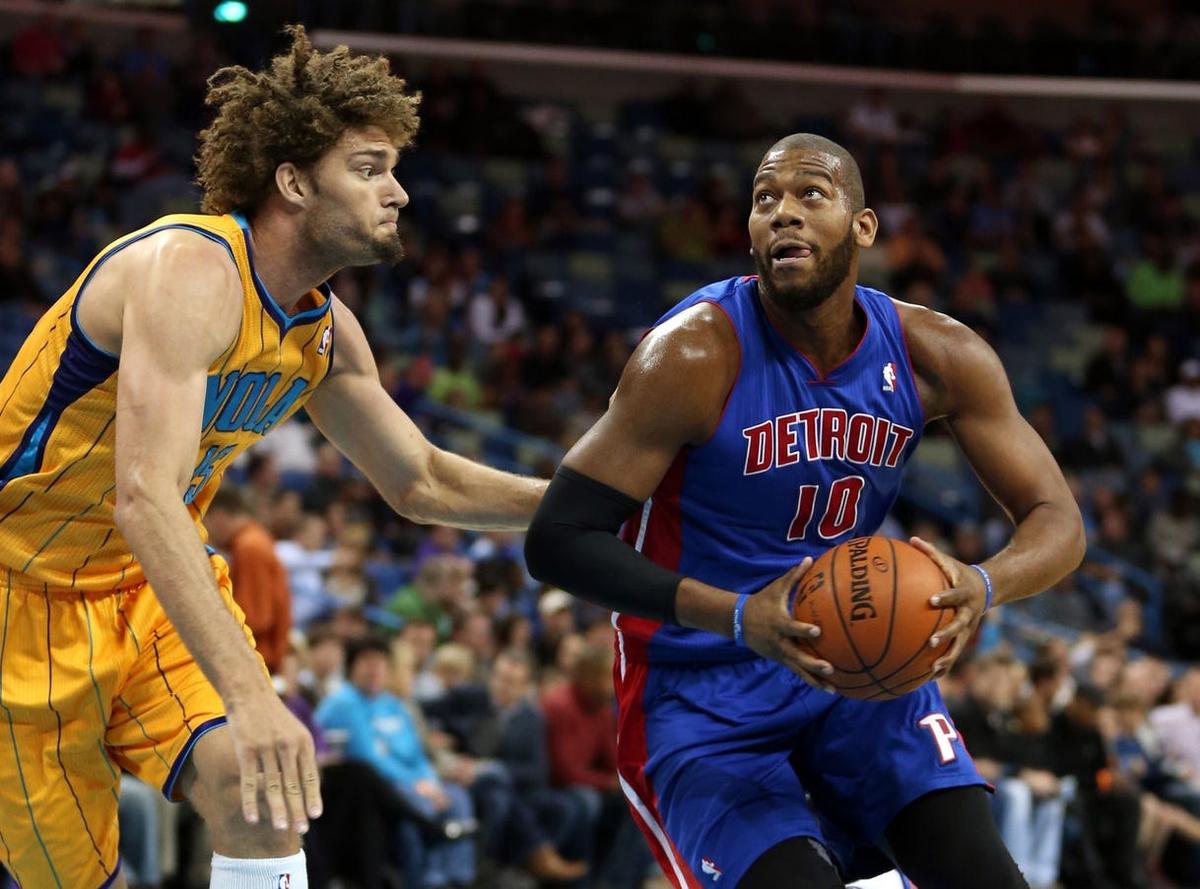Mar 1, 2013; New Orleans, LA, USA; Detroit Pistons center Greg Monroe (10) drives around New Orleans Hornets center Robin Lopez (15) in the first quarter of their game at the New Orleans Arena. Mandatory Credit: Chuck Cook-USA TODAY Sports