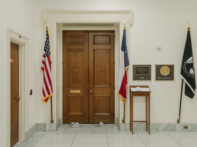 Newspapers in front of former Rep. Tony Gonzales' office at the Canon House Office Building in Washington, on Tuesday, April 14, 2026. Aides to Govs. Greg Abbott of Texas and Gavin Newsom of California are weighing whether to call quick elections to replace Gonzales and Eric Swalwell, respectively, House members accused of sexual misconduct. (Caroline Gutman/The New York Times)