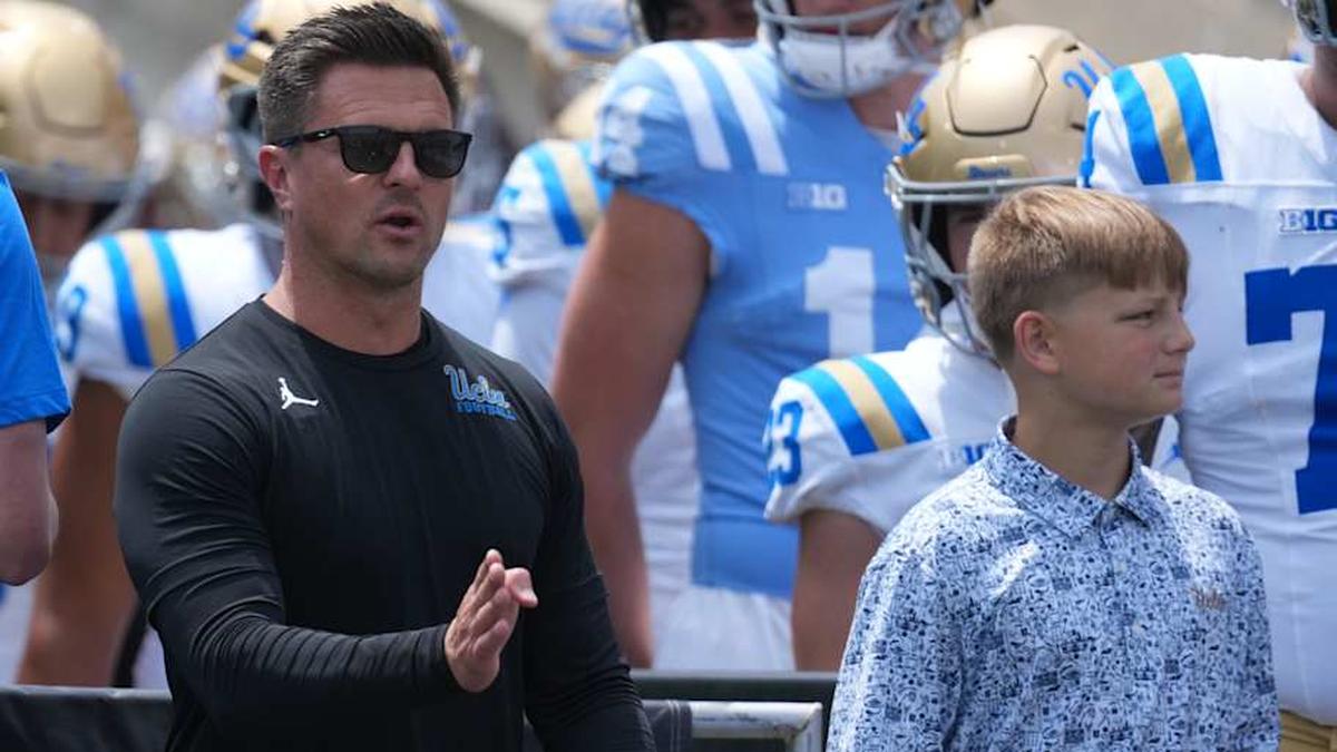  May 2, 2026; Pasadena, CA, USA; UCLA Bruins coach Bob Chesney (left) and son Bob Chesney watch during the spring game at Rose Bowl. Mandatory Credit: Kirby Lee-Imagn Images | Kirby Lee-Imagn Images 