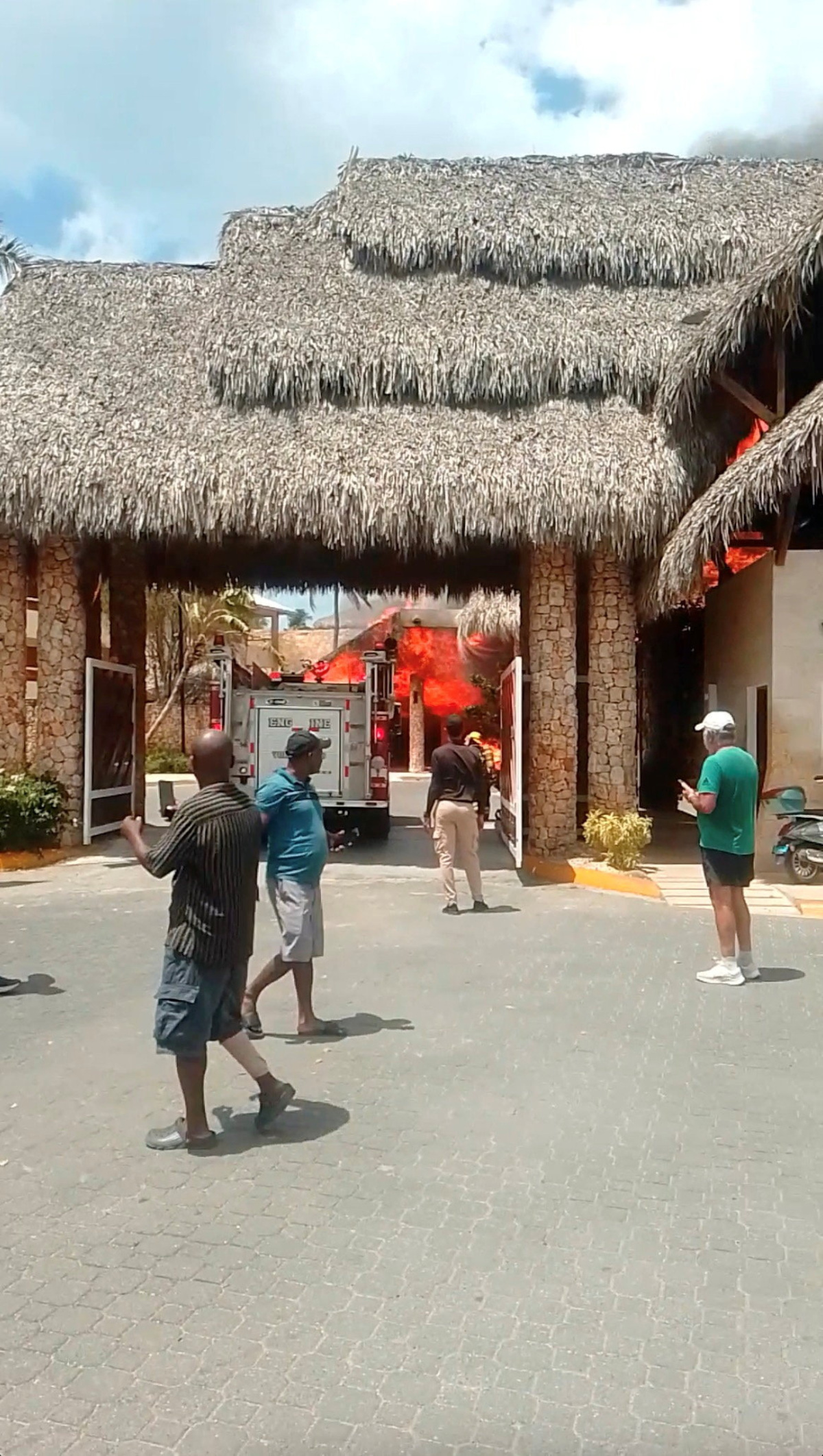 People look at a fire at Viva Dominicus resort in Bayahibe, La Altagracia, Dominican Republic, June 19, 2026, in this still taken from a social media video. Junito Mieses/via REUTERS