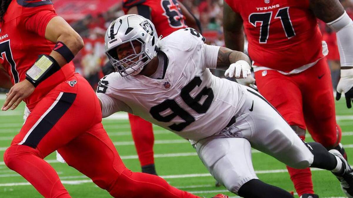 Dec 21, 2025; Houston, Texas, USA; Houston Texans quarterback C.J. Stroud (7) escapes the tackle of Las Vegas Raiders defensive tackle Jonah Laulu (96) in the first quarter at NRG Stadium. Mandatory Credit: Thomas Shea-Imagn Images | Thomas Shea-Imagn Images 