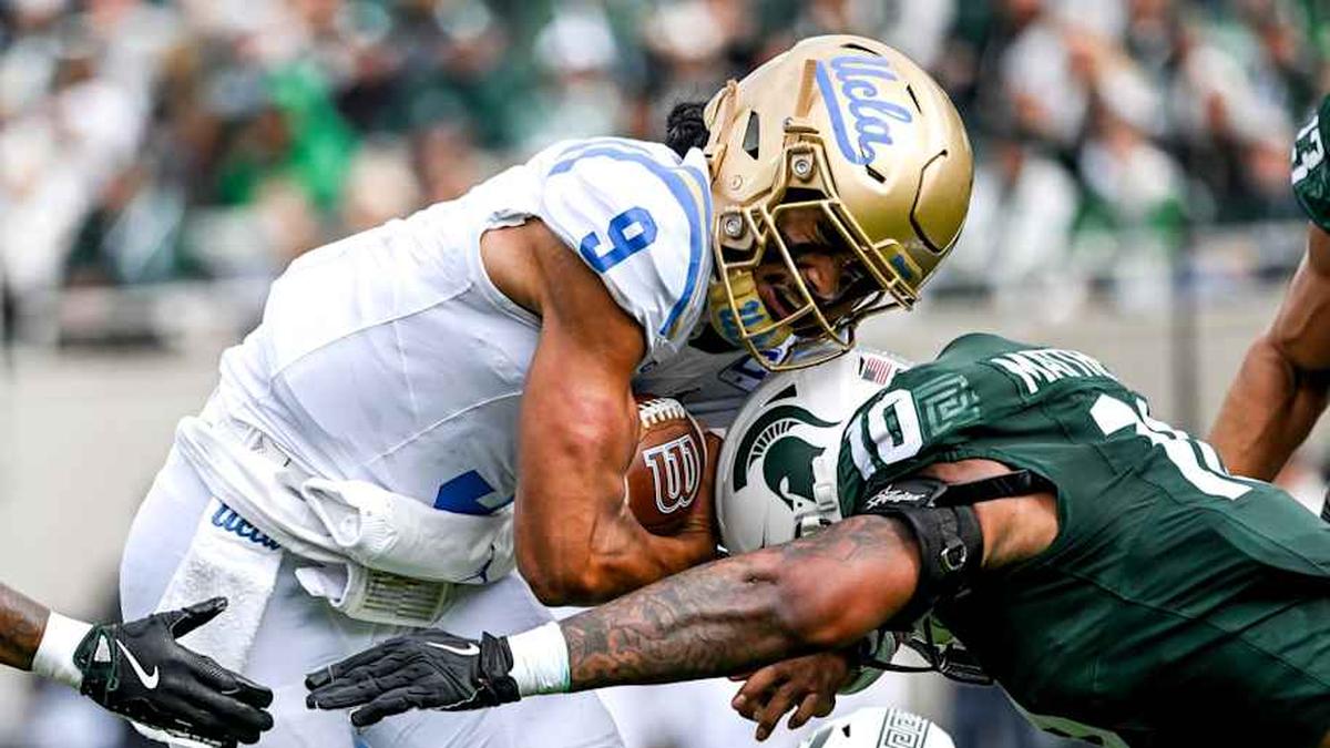  Michigan State's Wayne Matthews III, right, tackles UCLA's Nico Iamaleava during the second quarter on Saturday, Oct. 11, 2025, at Spartan Stadium in East Lansing. | Nick King/Lansing State Journal / USA TODAY NETWORK via Imagn Images 