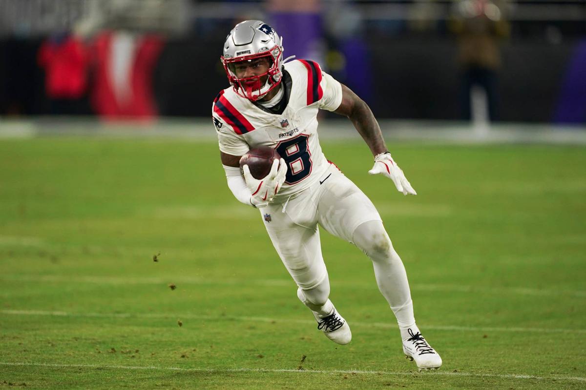  Dec 21, 2025; Baltimore, Maryland, USA; New England Patriots wide receiver Stefon Diggs (8) runs the ball against the Baltimore Ravens during the second half of the game at M&T Bank Stadium. Mandatory Credit: Mitch Stringer-Imagn Images 