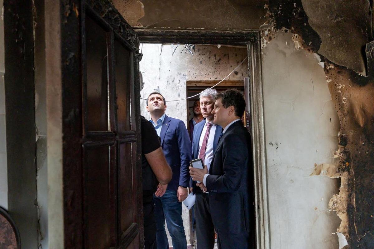Romanian President Nicusor Dan, accompanied by Defence Minister Radu Miruta and Minister of Internal Affairs Catalin Predoiu, visits the site of an explosion in a residential block of flats following a reported drone strike near the border with Ukraine, in Galati, Romania, May 29, 2026. Romanian Presidential Press Service/Handout via REUTERS