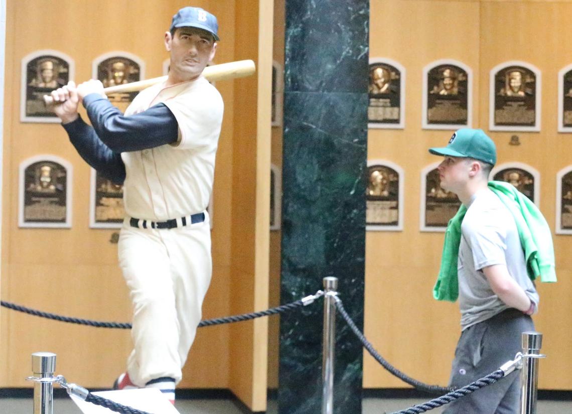  Dover High School senior Brett Davis and the statue of Boston Red Sox legend Ted Williams at the National Baseball Hall of Fame and Museum © Brandon Brown/Seacoastonline / USA TODAY NETWORK
