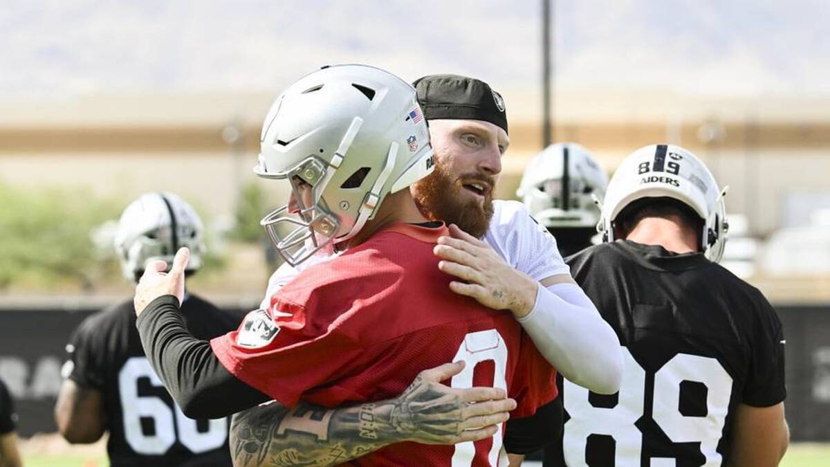  Jun 3, 2026; Henderson, NV, USA; Las Vegas Raiders defensive end Maxx Crosby (98) hugs quarterback Kirk Cousins (8) during organized team activities at Intermountain Health Performance Center. Mandatory Credit: Candice Ward-Imagn Images | Candice Ward-Imagn Images 