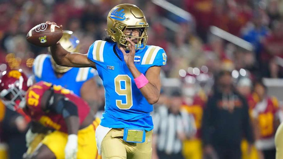  Nov 29, 2025; Los Angeles, California, USA; UCLA Bruins quarterback Nico Iamaleava (9) throws the ball against the Southern California Trojans in the first half at United Airlines Field at Los Angeles Memorial Coliseum. Mandatory Credit: Kirby Lee-Imagn Images | Kirby Lee-Imagn Images 