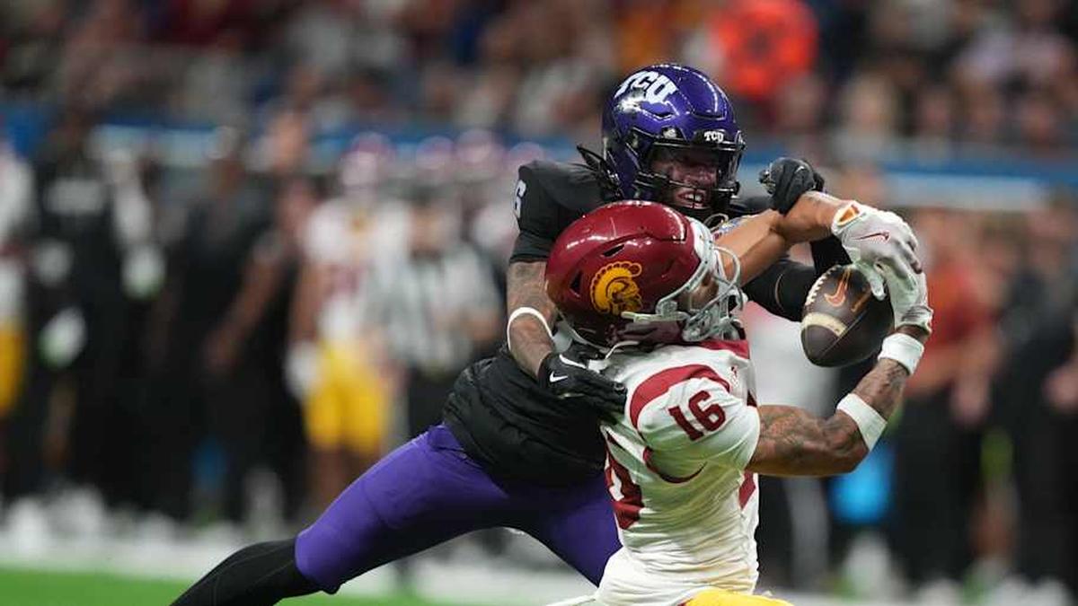  Dec 30, 2025; San Antonio, TX, USA; Southern California Trojans wide receiver Tanook Hines (16) catches the ball against TCU Horned Frogs cornerback Vernon Glover (26) in the second half during the Alamo Bowl at Alamodome. Mandatory Credit: Kirby Lee-Imagn Images | Kirby Lee-Imagn Images 