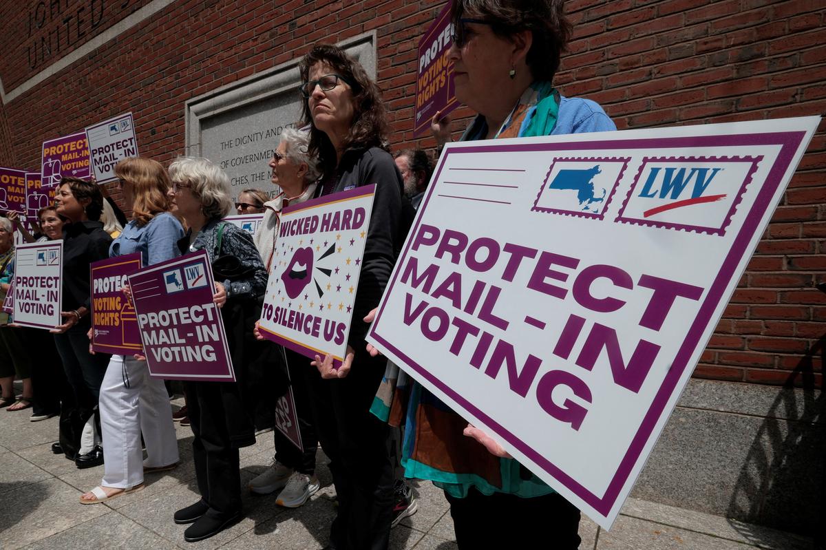Supporters gather outside the federal courthouse after a hearing in a lawsuit brought by a coalition of Democratic state attorneys general seeking to block U.S. President Donald Trump's executive order tightening rules on mail-in voting, in Boston, Massachusetts, U.S., June 2, 2026.   REUTERS/Brian Snyder