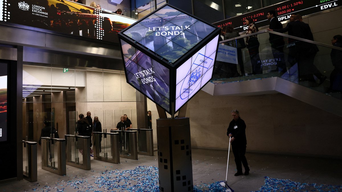 A worker cleans confetti after the opening of the markets at the London Stock Exchange in London, Britain January 19, 2026. REUTERS/Jack Taylor