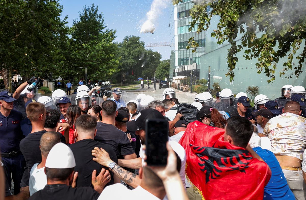 Police officers scuffle with protesters, during a demonstration against the government, following weeks of protests against a planned luxury resort backed by a company linked to Jared Kushner, the son-in-law of U.S. President Donald Trump, on an environmentally sensitive part of the Adriatic coast, in Tirana, Albania, July 2, 2026. REUTERS/Florion Goga
