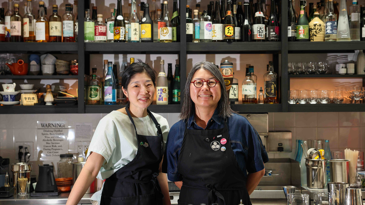 Umami Mart owners Yoko Kumano, left, and Kayoko Akabori stand at their bar in Oakland on Friday, May 15, 2026. (Ray Chavez/Bay Area News Group)