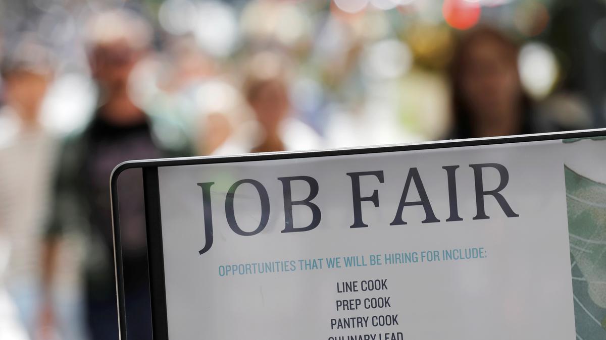 Signage for a job fair is seen on 5th Avenue after the release of the jobs report in Manhattan, New York City, U.S., September 3, 2021. REUTERS/Andrew Kelly