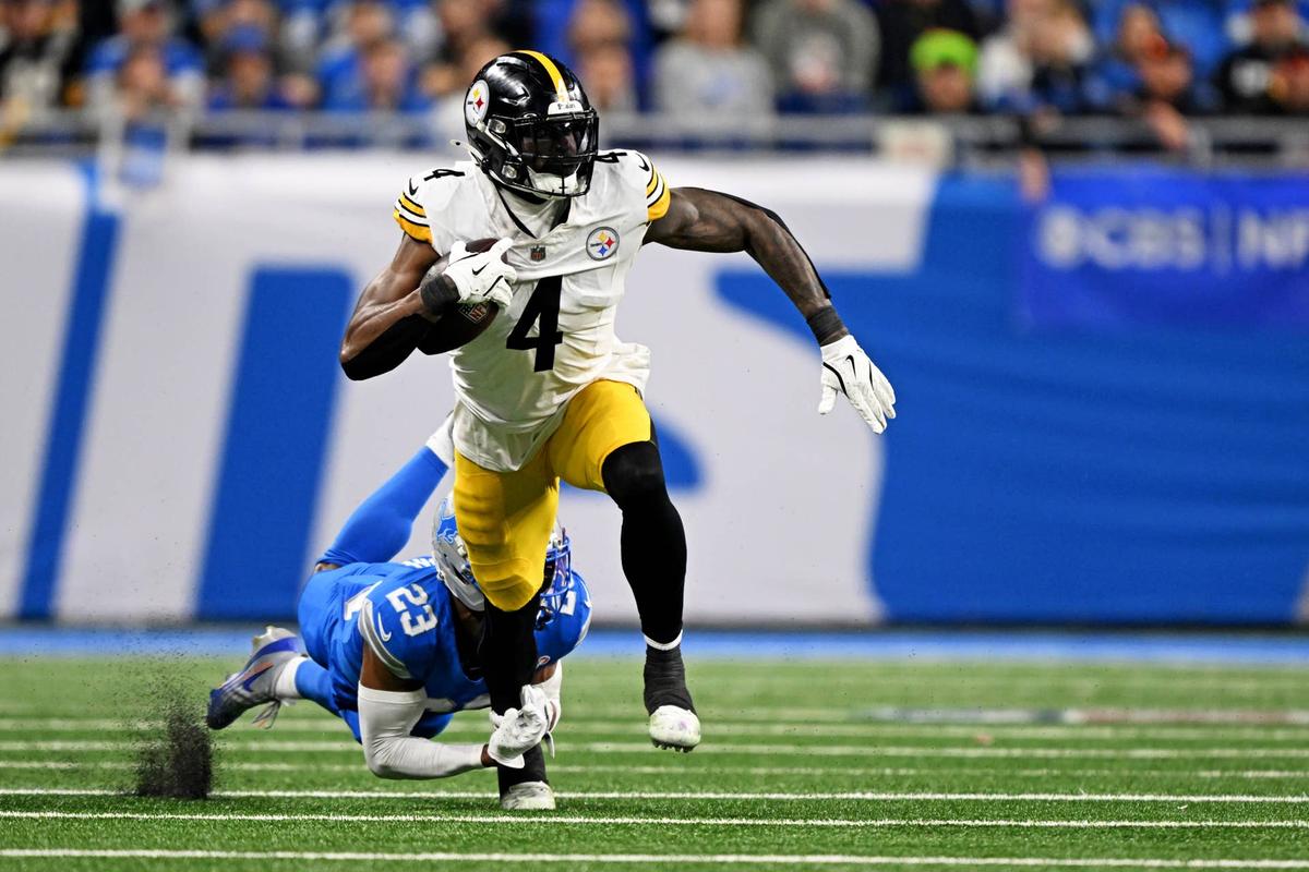  Dec 21, 2025; Detroit, Michigan, USA; Detroit Lions cornerback Rock Ya-Sin (23) tackles Pittsburgh Steelers wide receiver DK Metcalf (4) during the fourth quarter at Ford Field. Mandatory Credit: Lon Horwedel-Imagn Images 