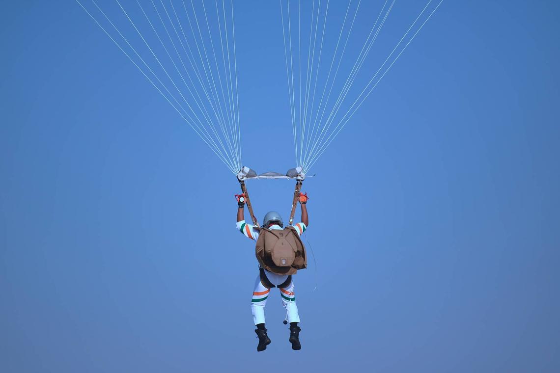  An Indian Air Force (IAF) paratrooper from the skydiving team Akash Ganga glides during a full dress rehearsal ahead of the Air Force Day parade at Hindon Air Force in Ghaziabad on October 6, 2020. (Photo by Money SHARMA / AFP) (Photo by MONEY SHARMA/AFP via Getty Images) 