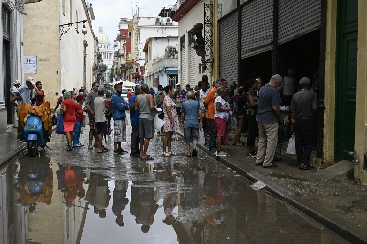 Cubans stand in line to buy food during a power outage in Havana on Dec. 3, 2025. Yamil Lage/AFP via Getty Images 