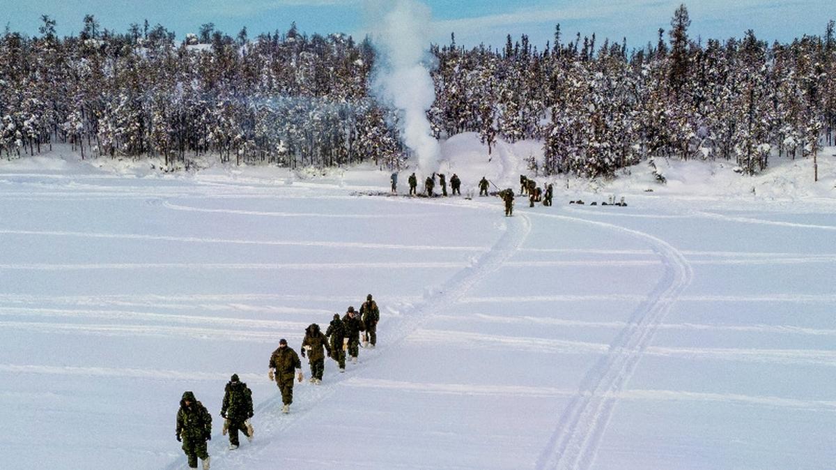 FILE PHOTO: A drone view shows members of 41 Canadian Brigade Group, as part of Task Force Grizzly, carrying their gear back to their arctic tents as Canadian Armed Forces deploy to "Operation Nanook-Nunalivut," an annual series of drills designed to highlight the military's ability to defend the Canadian Arctic, in Yellowknife, Northwest Territories, Canada February 15, 2026. REUTERS/Carlos Osorio/File Photo