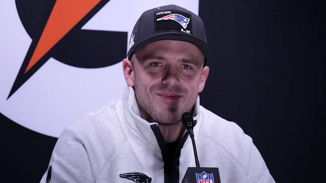  Feb 2, 2026; San Jose, CA, USA; New England Patriots linebacker Robert Spillane (14) speaks to the media during Opening Night for Super Bowl LX at San Jose Convention Center. Mandatory Credit: Kirby Lee-Imagn Images | Kirby Lee-Imagn Images 